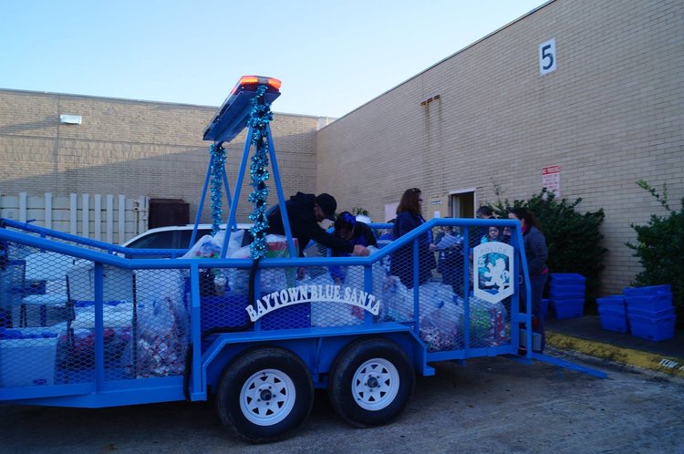 The blue Baytown Blue Santa trailer parked outside a building
